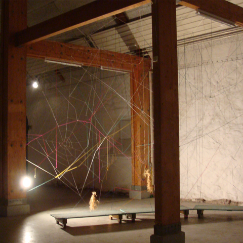Worldwild Web is a 3x3 meter 3 dimensional spiderweb installation constructed of colourful strings by Ida Marie 